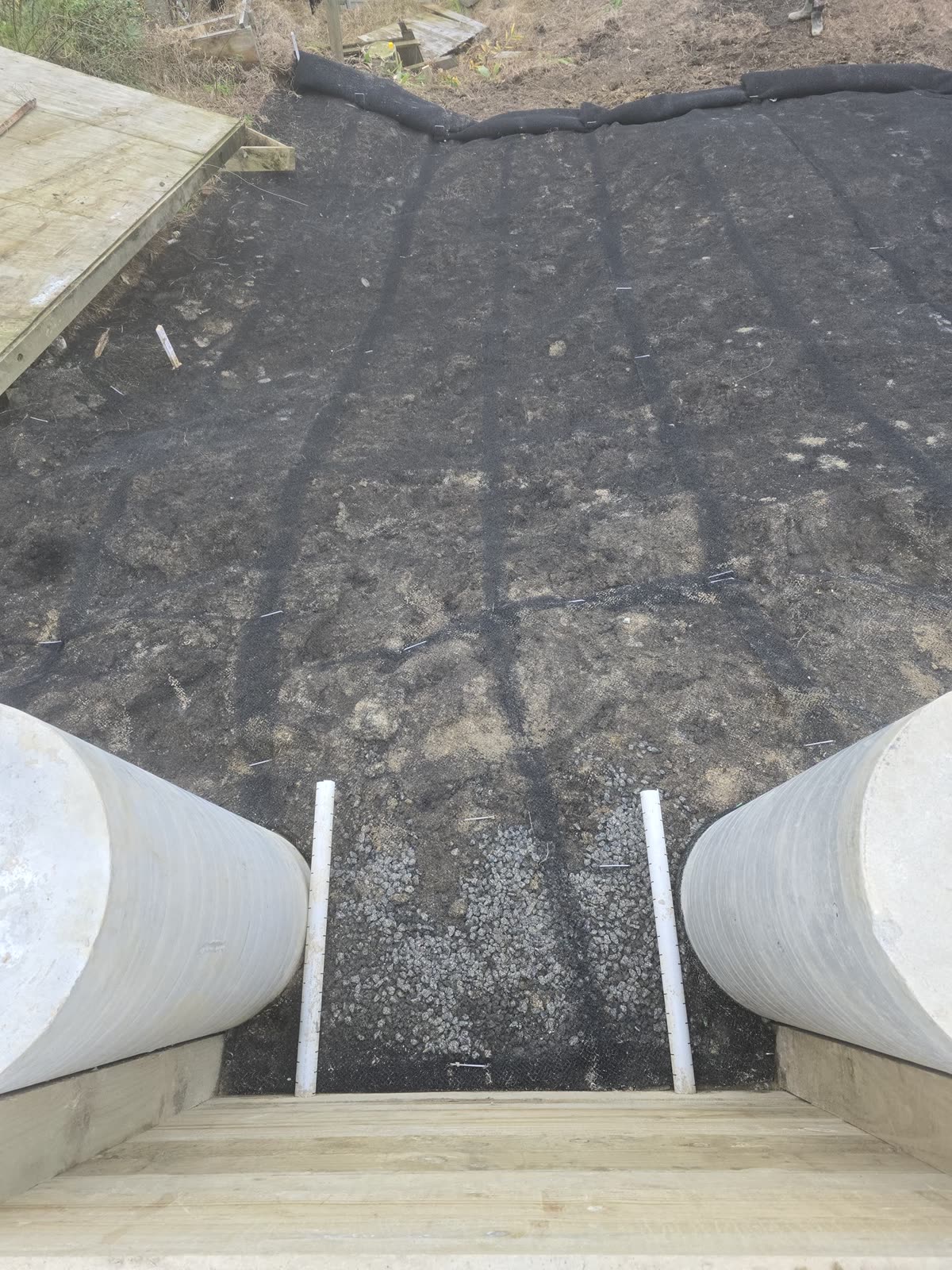 Crew fixing mesh across a slope face